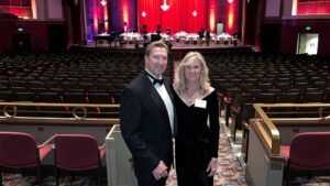 Terry Tallen stands beside his wife Diane with his Laurel Pin award. 