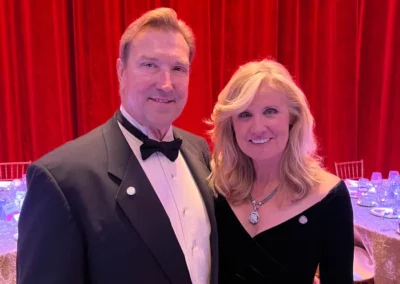 Terry Tallen stands beside his wife Diane with his Laurel Pin award